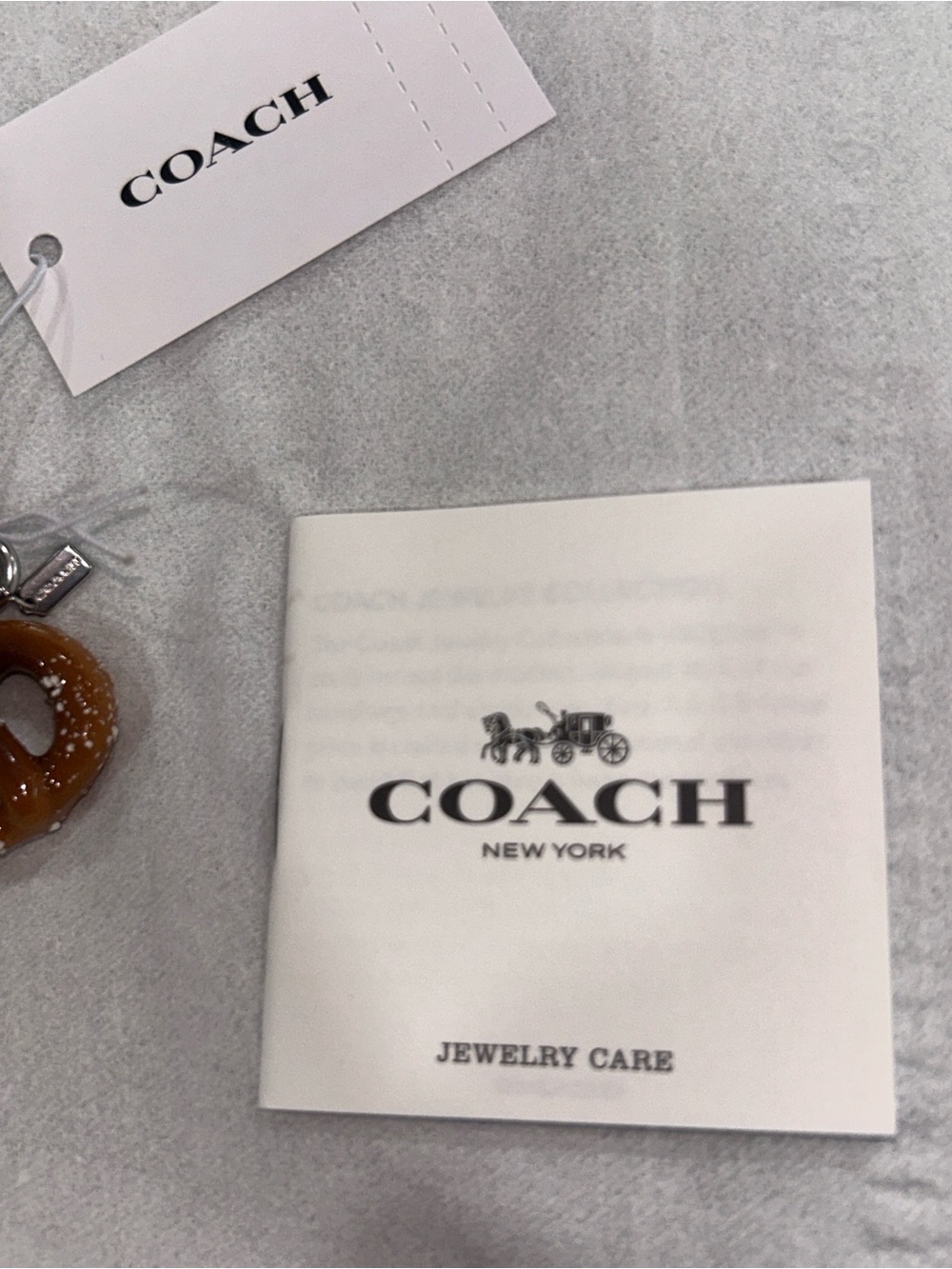 Coach Pretzel Charm with micro hang tag, care booklet, tag & Dust Bag. NWT - Picture 5 of 7